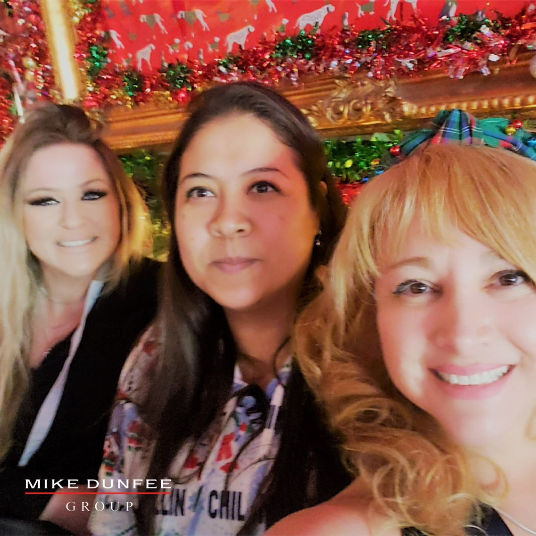 10-The Mike Dunfee Group team celebrating with a selfie the 2021 annual Christmas gathering